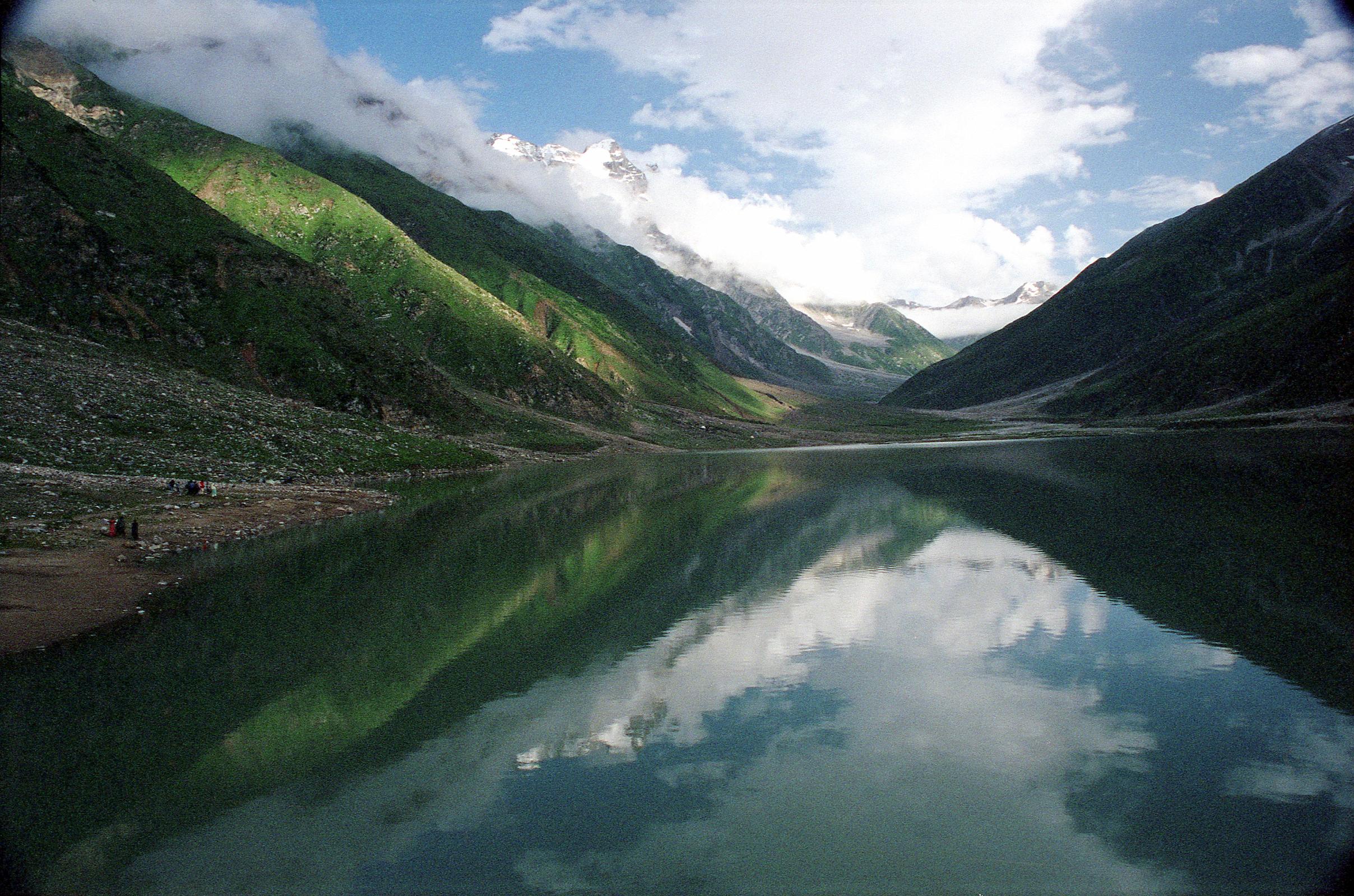 13 Lake Saiful Maluk With Malika Parbat In Kaghan Valley  Ilys drove 9km from Naran in half an hour up 770m to Lake Saiful Maluk (3200m). The overcast skies slowly parted to reveal this beautiful lake, set in alpine surroundings. The water reflects the surrounding peak of Malika Parbat (5290m). Lake Saiful Maluk (3200m) is the most popular lake in Pakistan ... for middle-class Pakistanis that is. They arrived in jeeps, small buses, and on foot, swarming the lake, and vastly outnumbering the one and only foreigner.